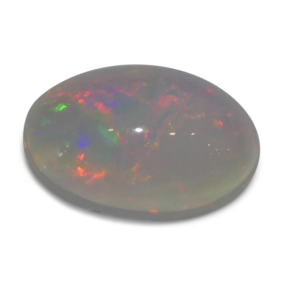 3.32ct White Crystal Opal from Ethiopia, oval cabochon gemstone with play of color by SkyJems Canadian gem experts