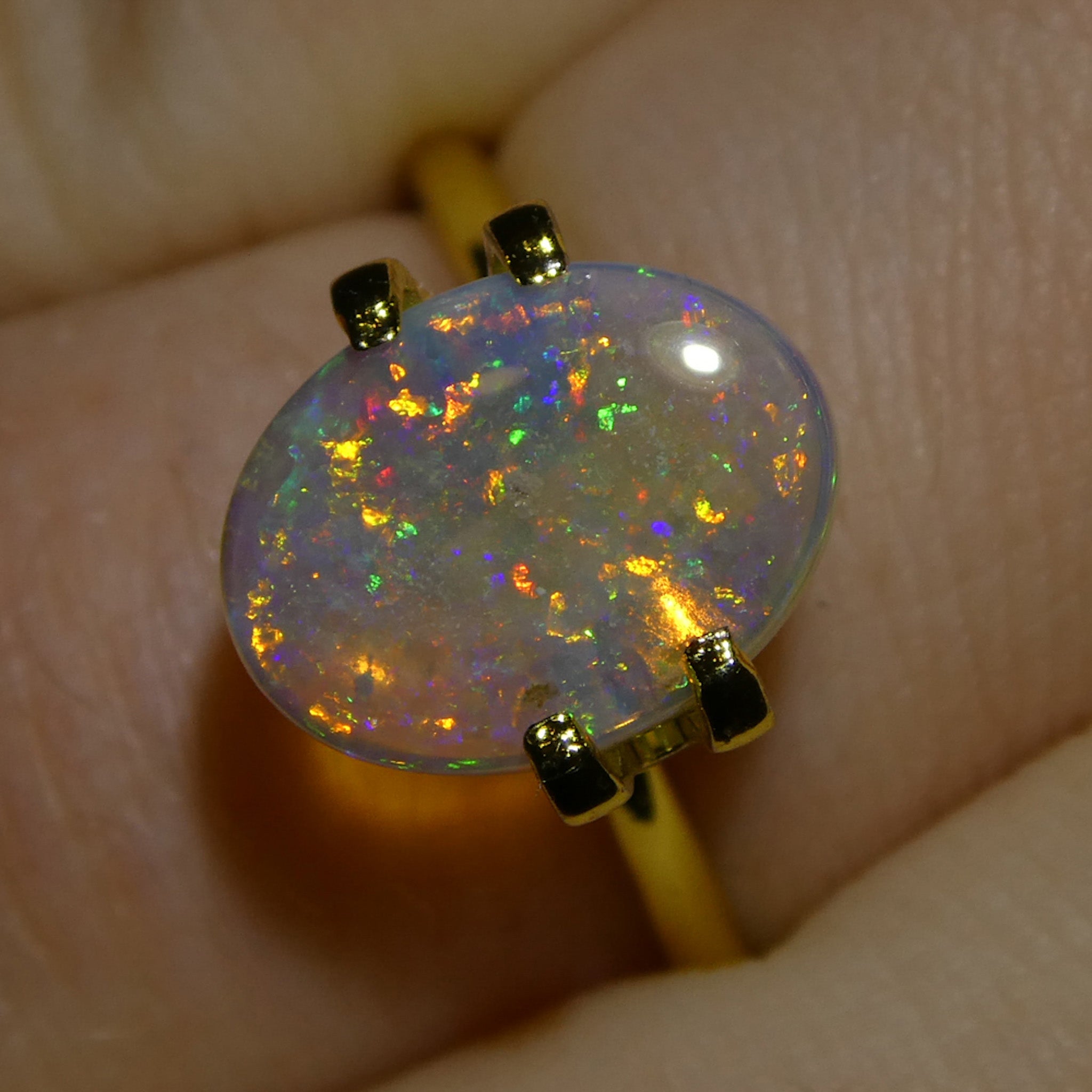 1.54ct White Oval Cabochon Opal from Australia with Play of Color, premium gemstone by SkyJems Canadian gem experts