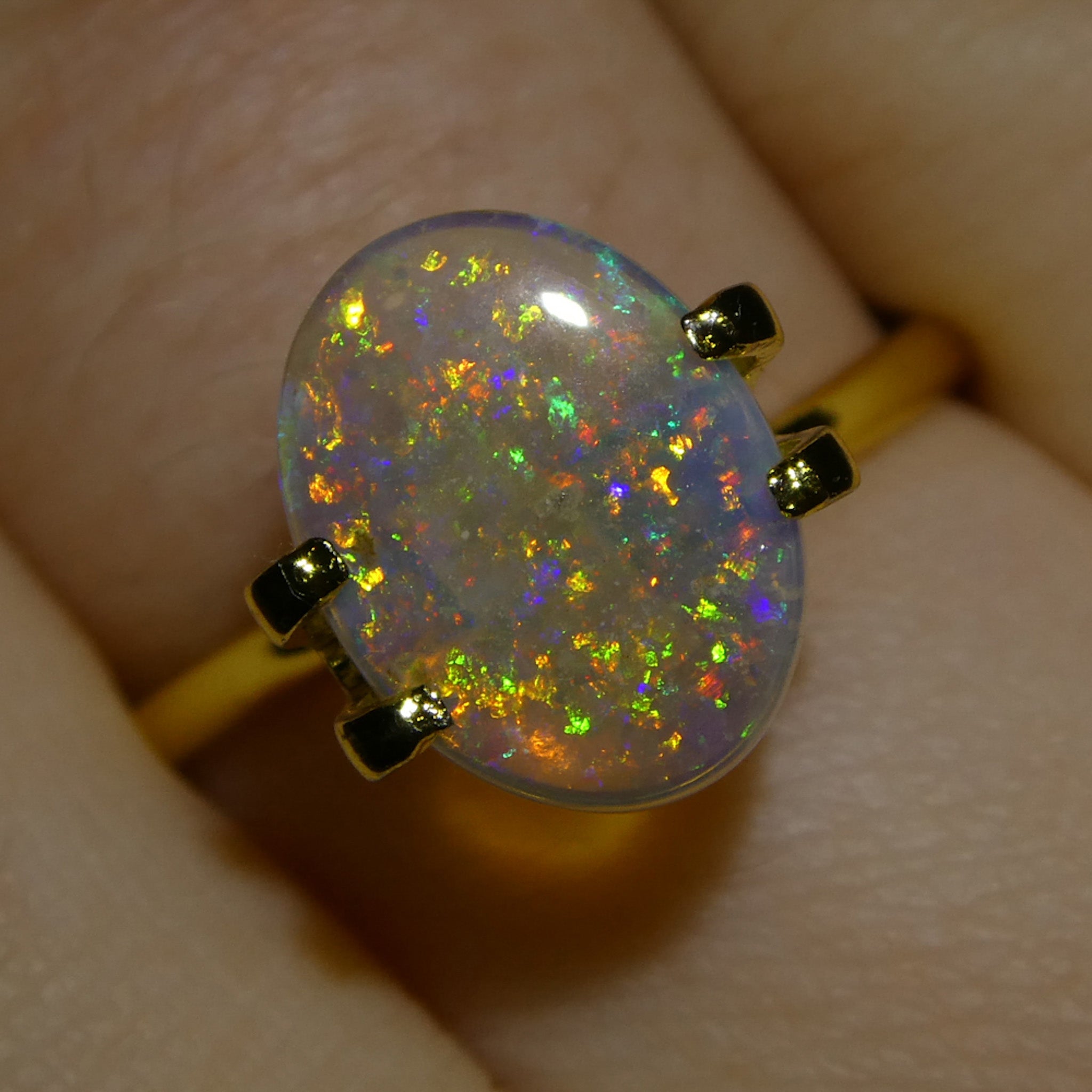 1.54ct White Oval Cabochon Opal from Australia with Play of Color, premium gemstone by SkyJems Canadian gem experts