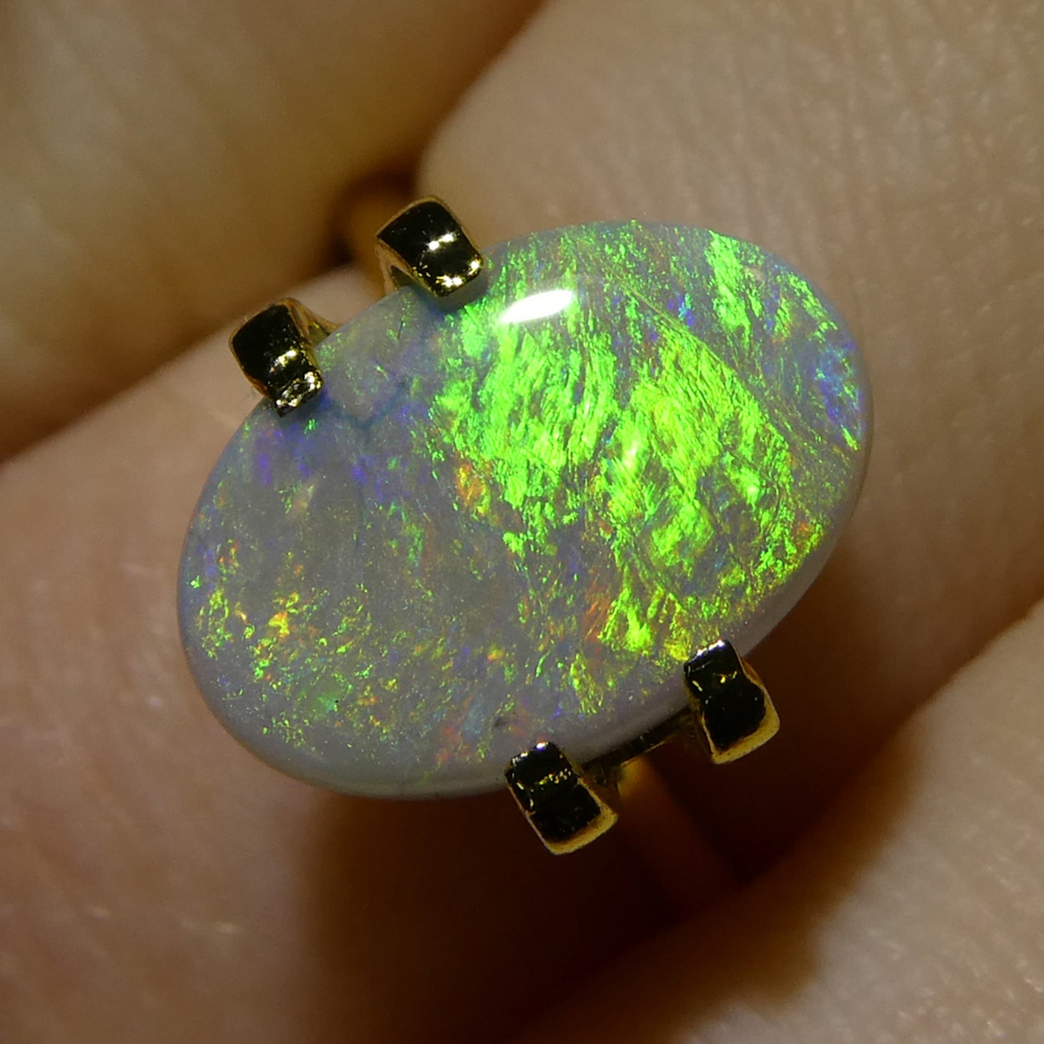 2-carat oval gray Australian opal cabochon with play of color, premium gemstone from SkyJems Canadian gem specialists