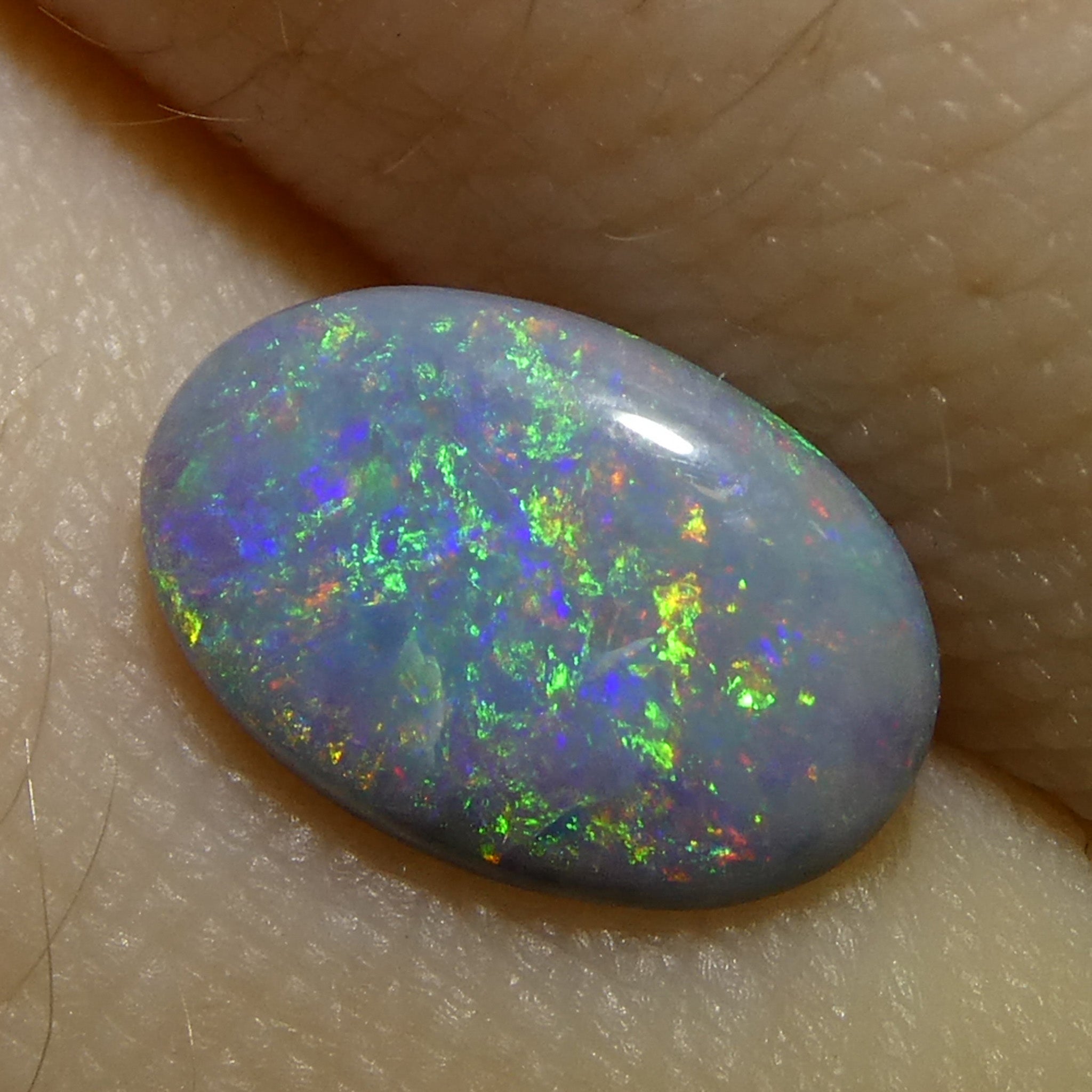 0.86ct Gray Oval Cabochon Opal from Australia, rare gemstone with play of color by SkyJems Canadian gem experts
