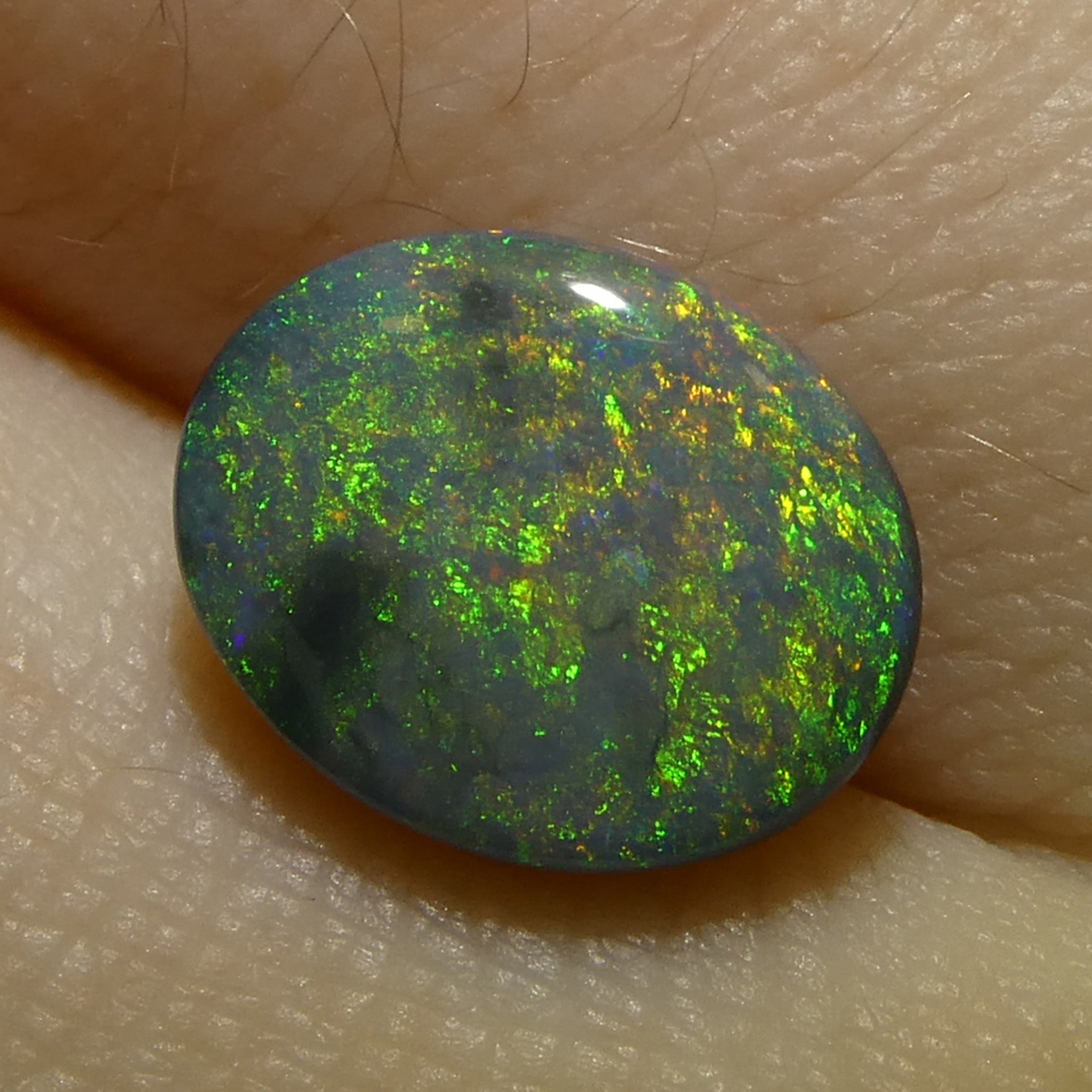 1.49ct Gray Oval Cabochon Opal from Australia, rare gemstone with play of color by SkyJems Canadian gem experts