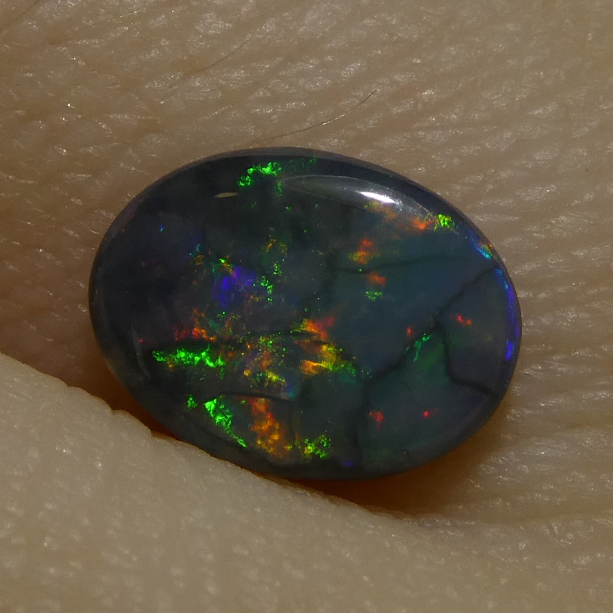0.59ct Gray Oval Cabochon Opal from Australia, rare gemstone with play of color by SkyJems Canadian gem experts