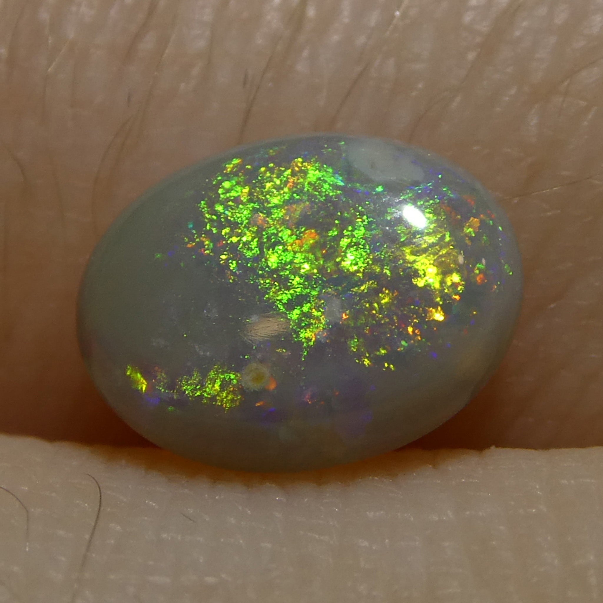 0.72ct Gray Oval Cabochon Opal from Australia, rare gemstone with play of color by SkyJems Canadian gem experts