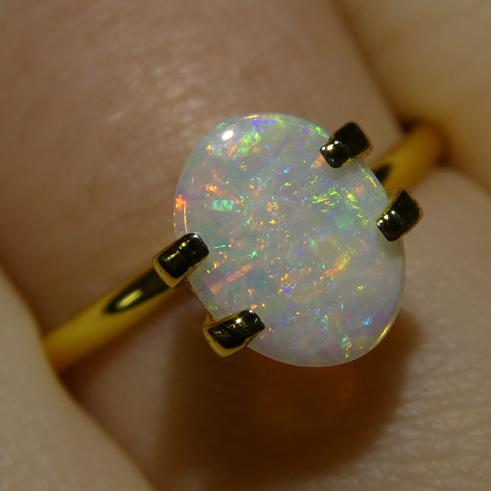 0.55ct White Oval Cabochon Opal from Australia, premium gemstone by SkyJems Canadian gem specialists