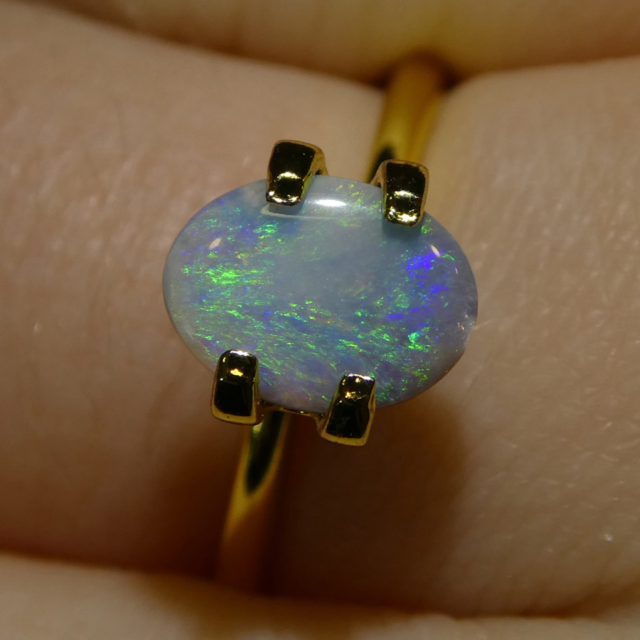 0.47ct White Oval Cabochon Opal from Australia with Play of Color, premium gemstone by SkyJems Canadian gem experts