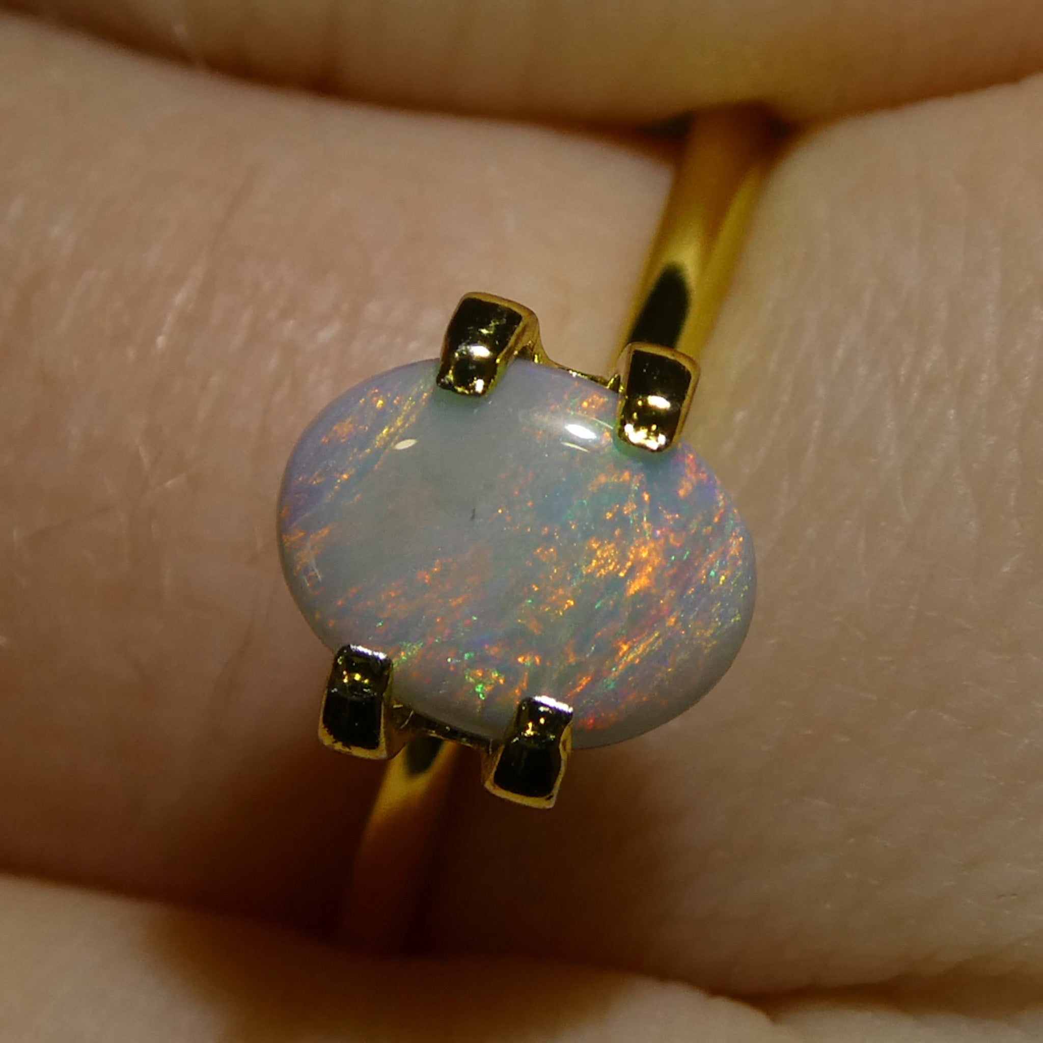 0.67ct Gray Oval Cabochon Opal from Australia with Play of Color, premium gemstone by SkyJems Canadian gem experts