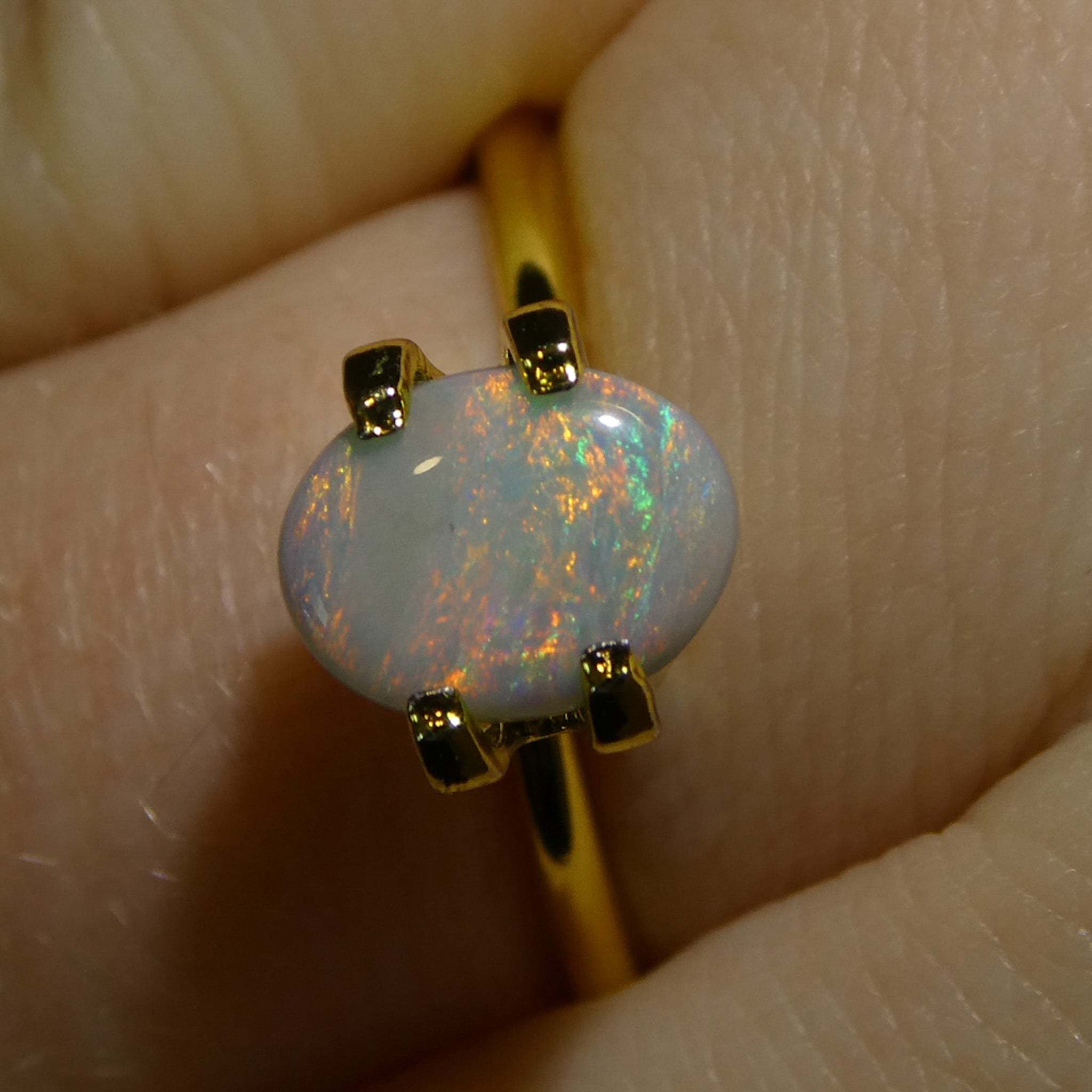 0.67ct Gray Oval Cabochon Opal from Australia with Play of Color, premium gemstone by SkyJems Canadian gem experts