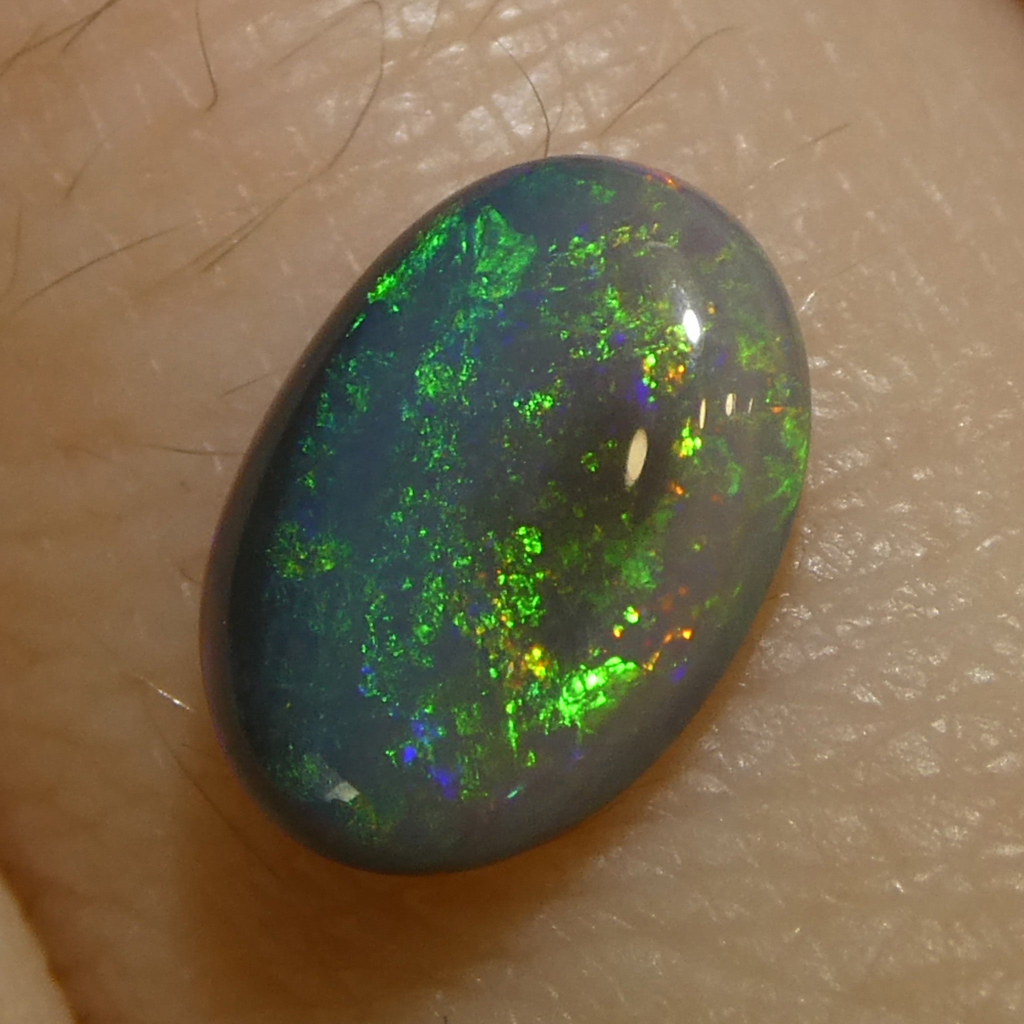 0.59ct Gray Oval Cabochon Opal from Australia with Play of Color, premium gemstone by SkyJems Canadian gem experts