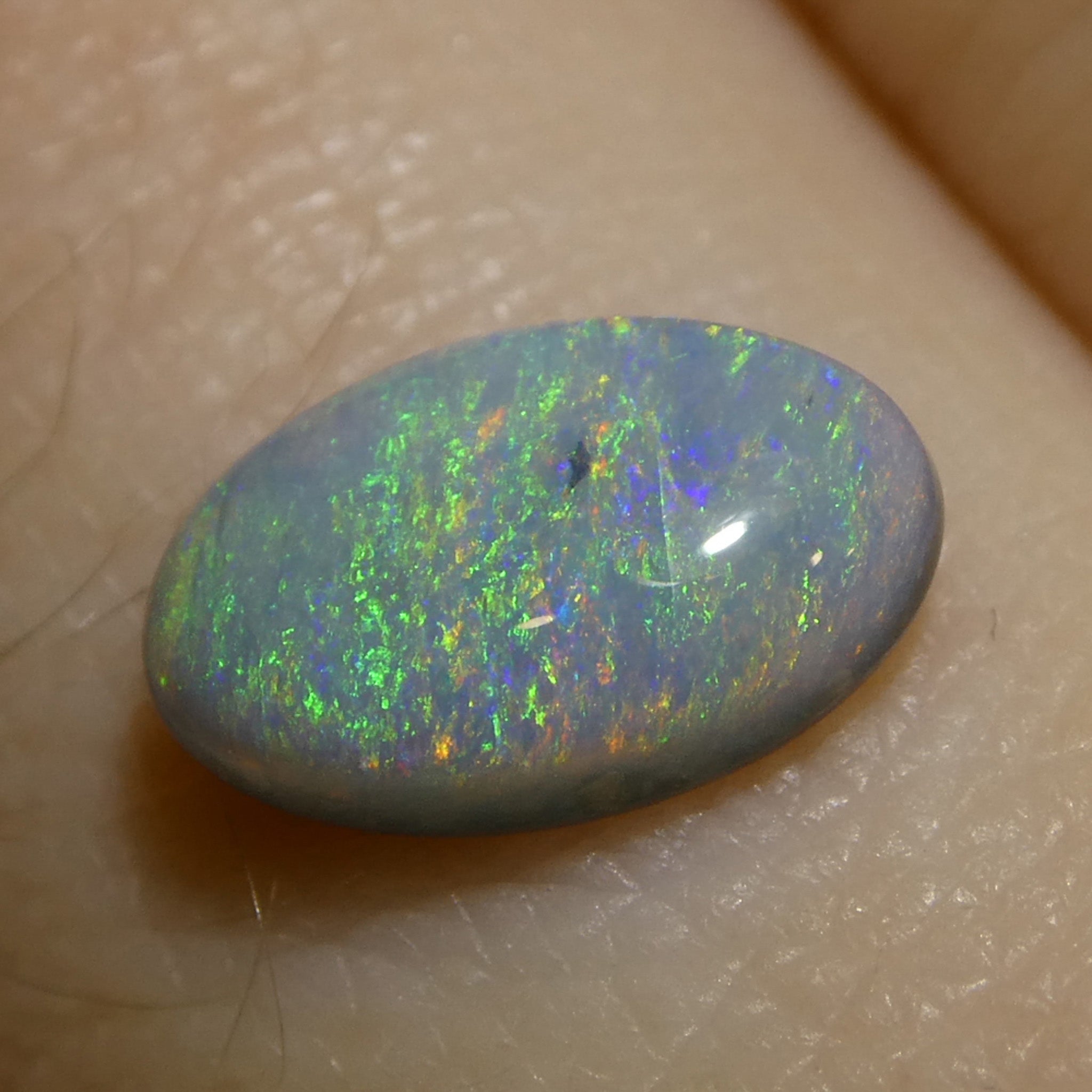 0.71ct Gray Oval Cabochon Opal from Australia with Play of Color, premium gemstone by SkyJems Canadian gem experts