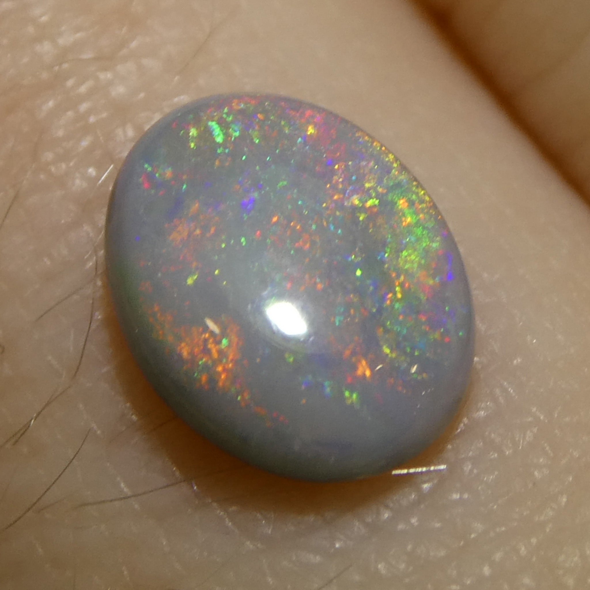 0.73ct Gray Oval Cabochon Opal from Australia with Play of Color, premium gemstone by SkyJems Canadian gem experts