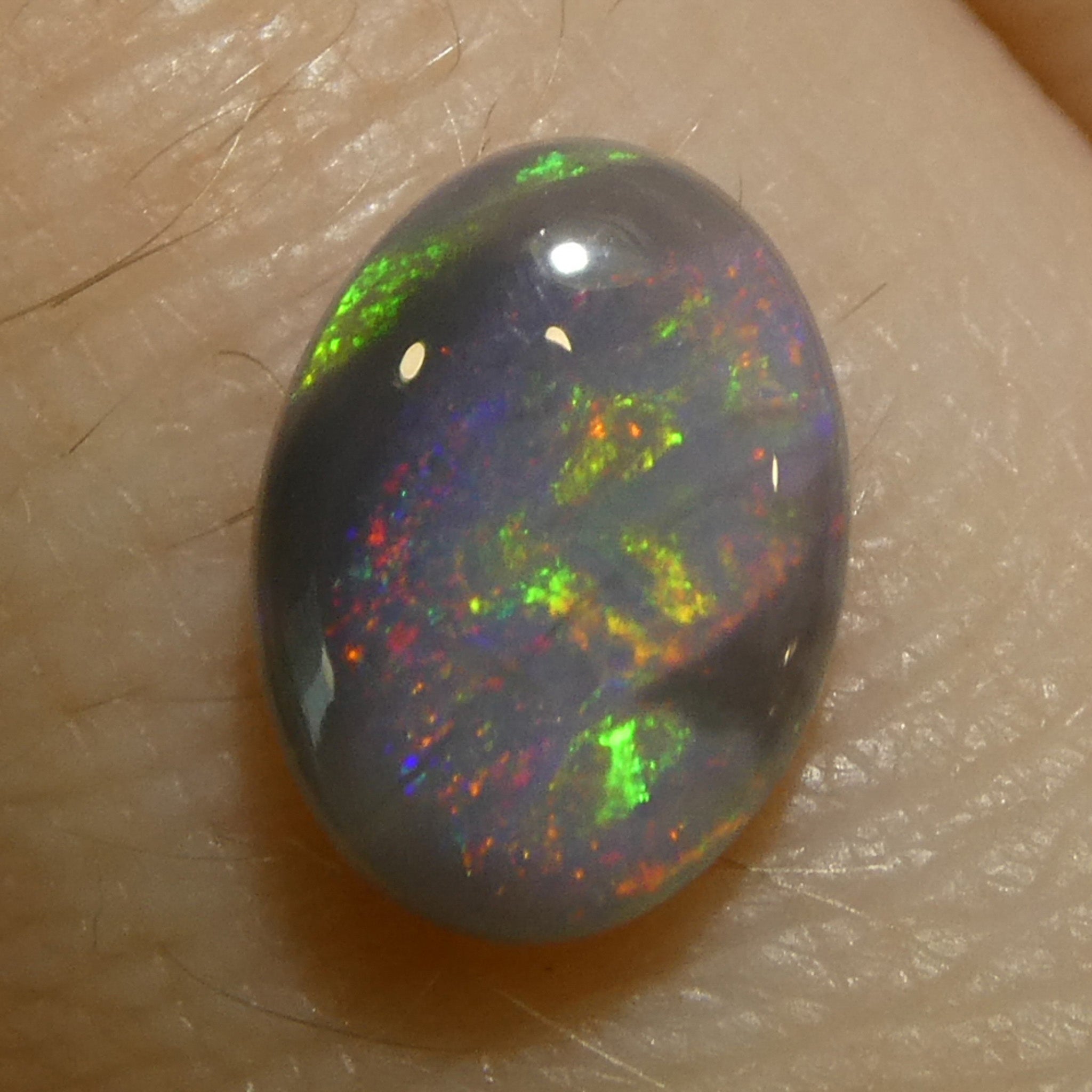 0.63ct Gray Oval Cabochon Opal with Play of Color from Australia, premium gemstone by SkyJems Canadian gem experts