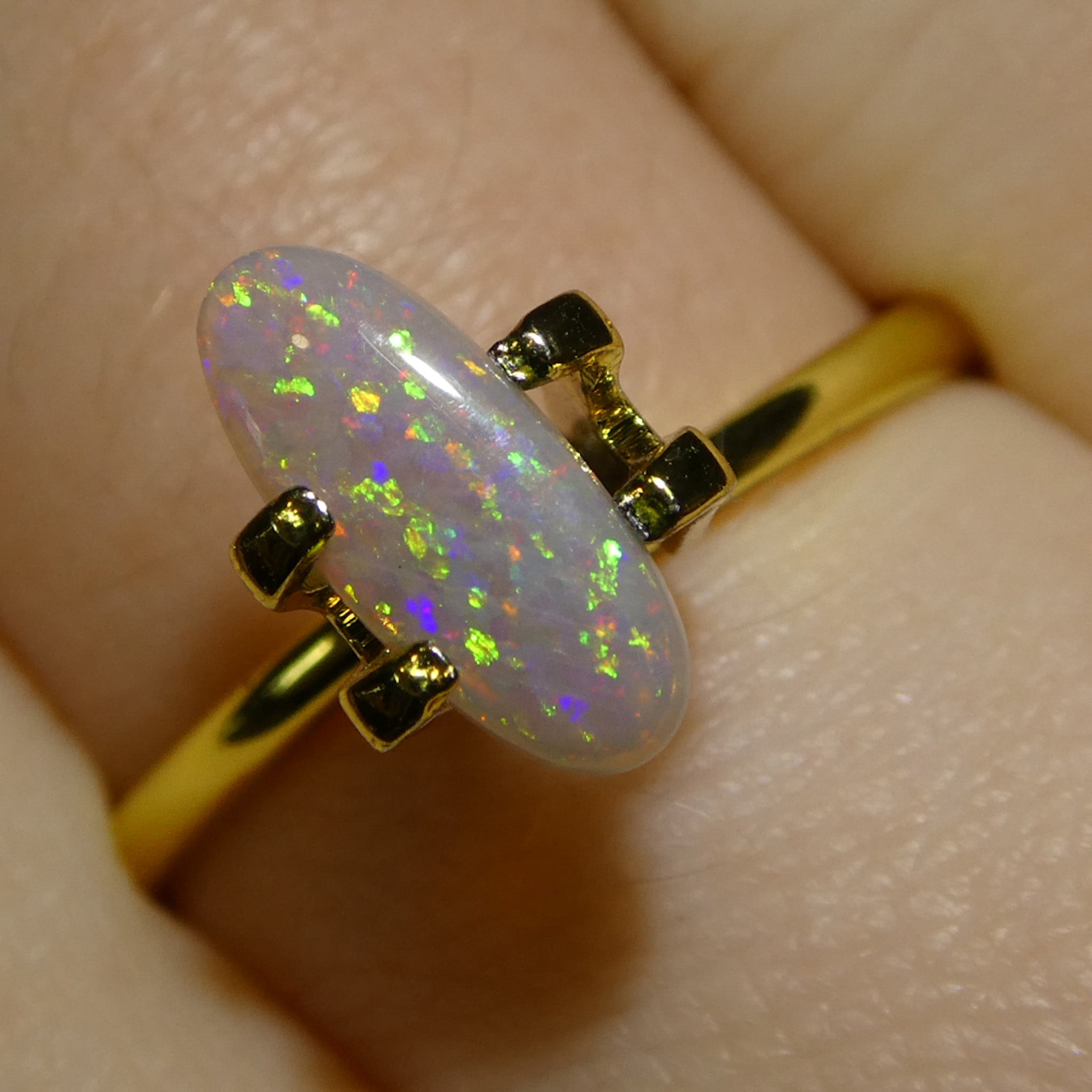 0.62ct White Opal Cabochon with Play of Color from Australia, premium gemstone by SkyJems Canadian gem specialists