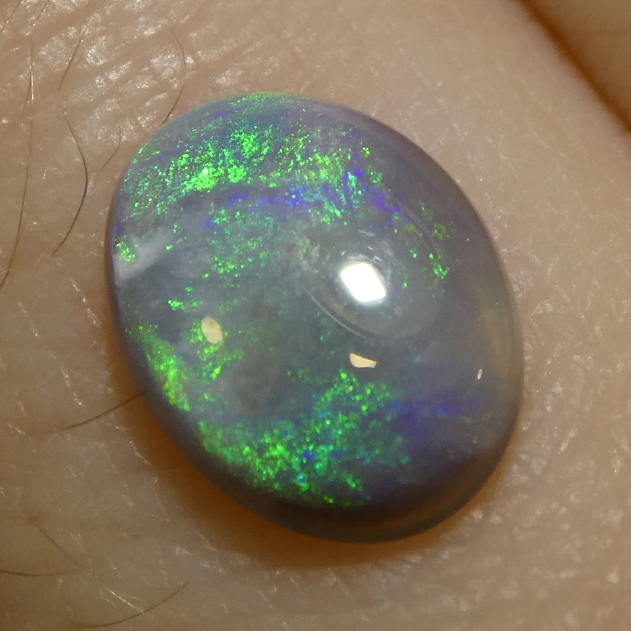 0.58ct Gray Oval Cabochon Opal from Australia with Play of Color, premium gemstone by SkyJems Canadian gem experts
