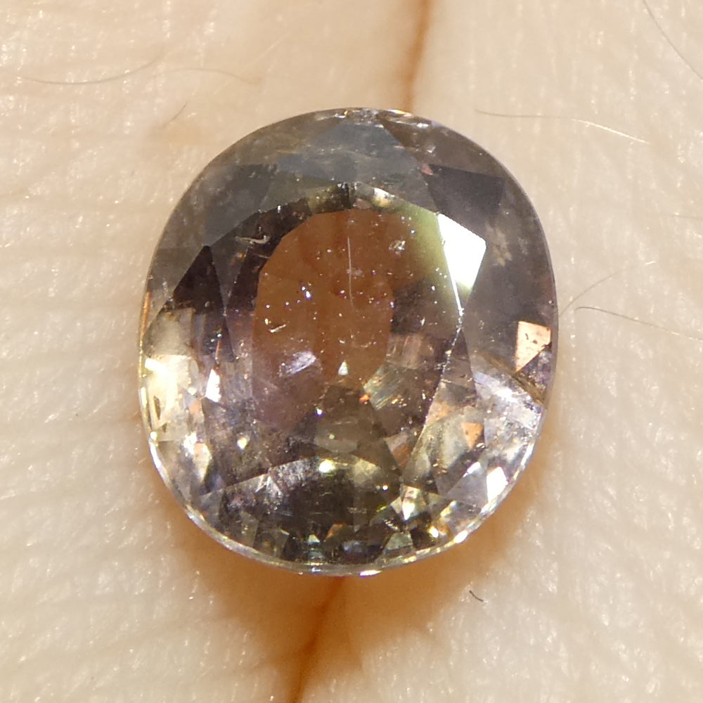 1.76ct Greyish Pink Tanzanian Sapphire, oval-cut single stone from SkyJems' premium colored gemstone collection