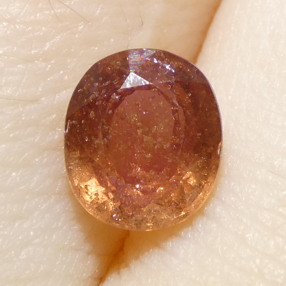 1.4ct Tanzanian Pink Sapphire, cushion-cut, medium-light orangey pink gemstone from SkyJems Canadian gem specialists