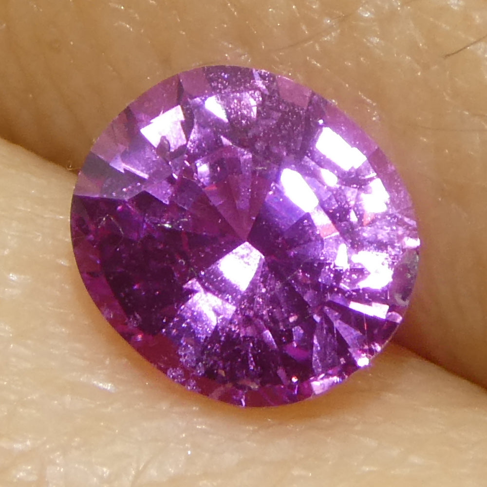 0.99ct Oval Purple-Pink Madagascar Sapphire from SkyJems, premium heated gemstone with vivid color and elegant step cut