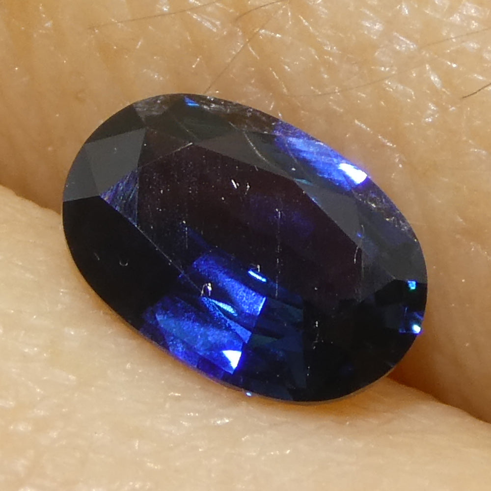 0.73ct Oval Blue Sapphire from Madagascar, very slightly purplish, Step Cut gemstone by SkyJems Canadian gem experts