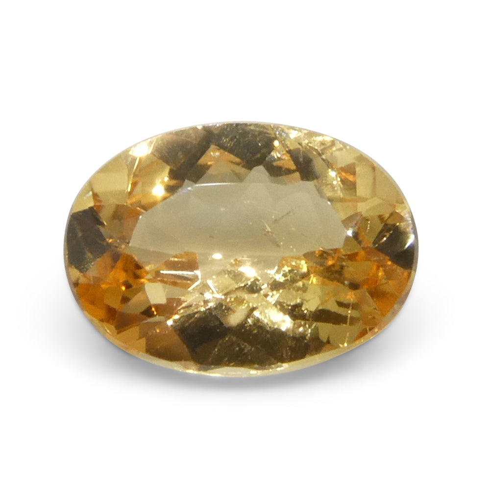 1.17ct Oval Brazilian Imperial Topaz in warm orange-yellow, unheated natural gemstone from SkyJems' premium collection