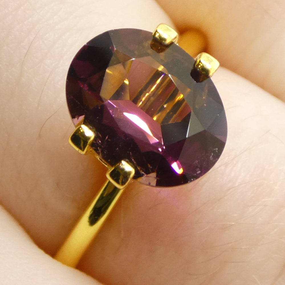 2.1ct Oval Pink Tourmaline from Brazil, slightly orangy hue, precision step-cut gemstone by SkyJems Canadian gem specialists