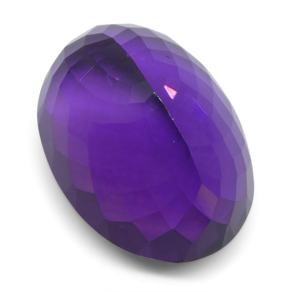 Large 20.72 ct purple Brazilian Amethyst oval gemstone from SkyJems, showcasing brilliant cut and rich violet hue