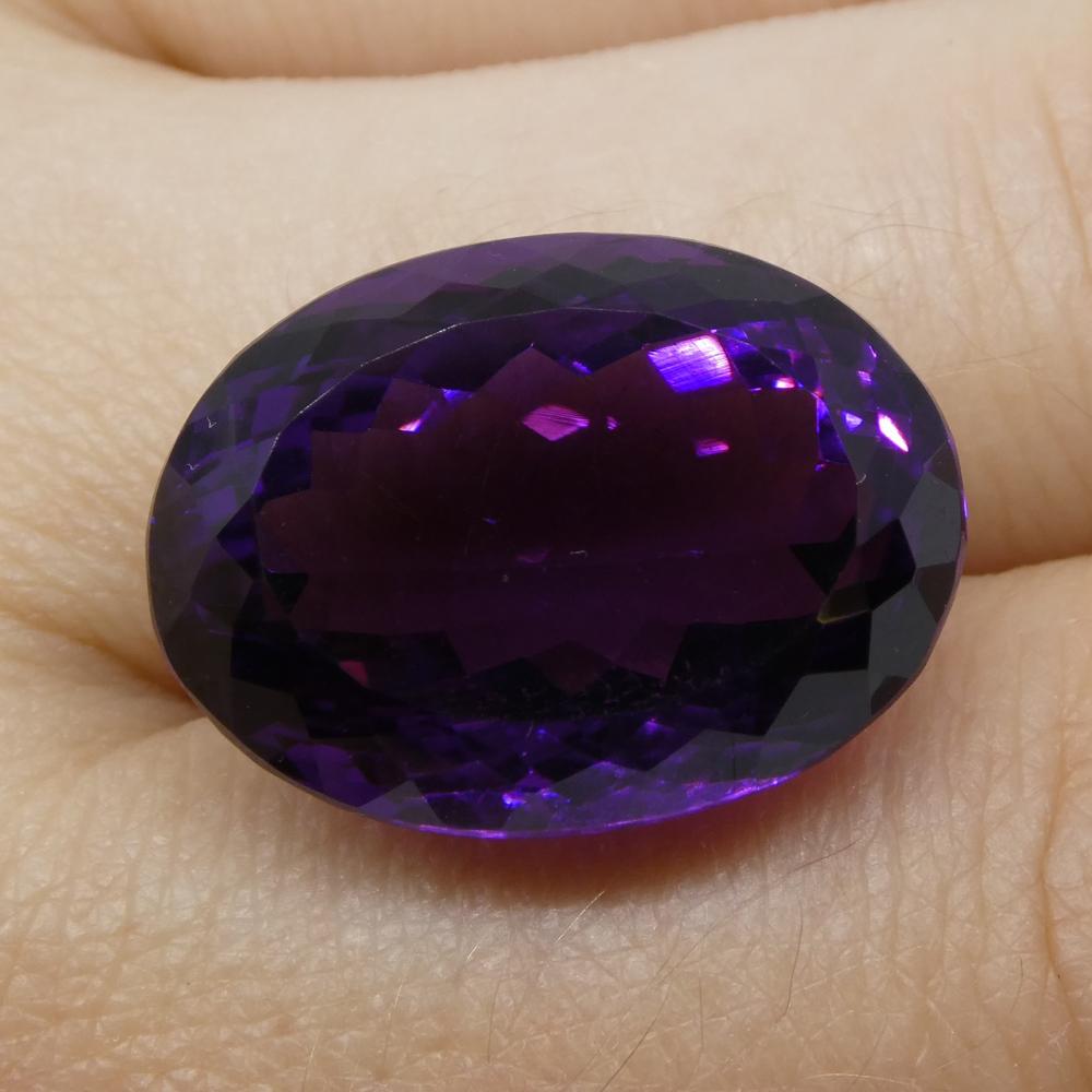 Large 20.72 ct purple Brazilian Amethyst oval gemstone from SkyJems, showcasing brilliant cut and rich violet hue