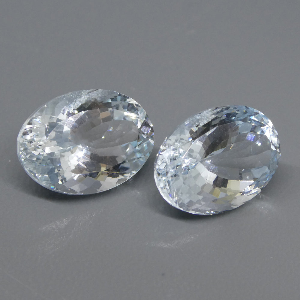 Vivid blue Brazilian aquamarine oval pair, 12.58 carats, premium mixed cut gemstones from SkyJems Canadian gem specialists