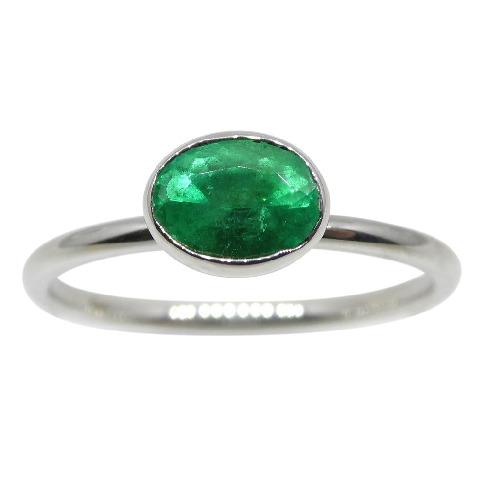 Dainty Colombian emerald oval stacker ring in 10kt white gold, handcrafted by SkyJems Canadian jewellers since 1967