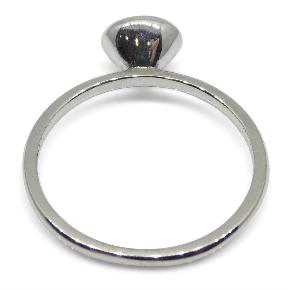 Dainty Colombian emerald stacker ring in 10kt white gold, oval green gemstone, handcrafted by SkyJems Canadian jewellers