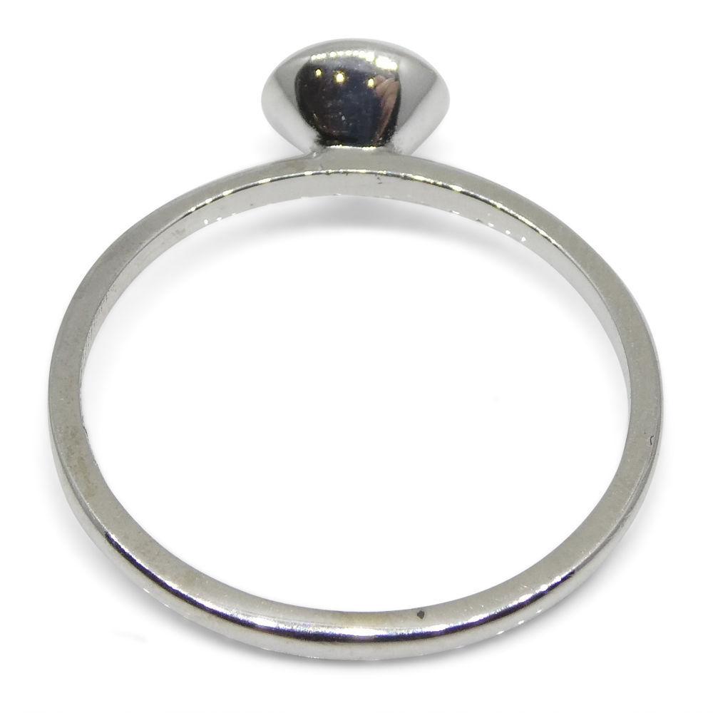 Dainty oval ruby stacker ring in 10kt white gold, Myanmar origin, handcrafted by SkyJems Canadian jewellers