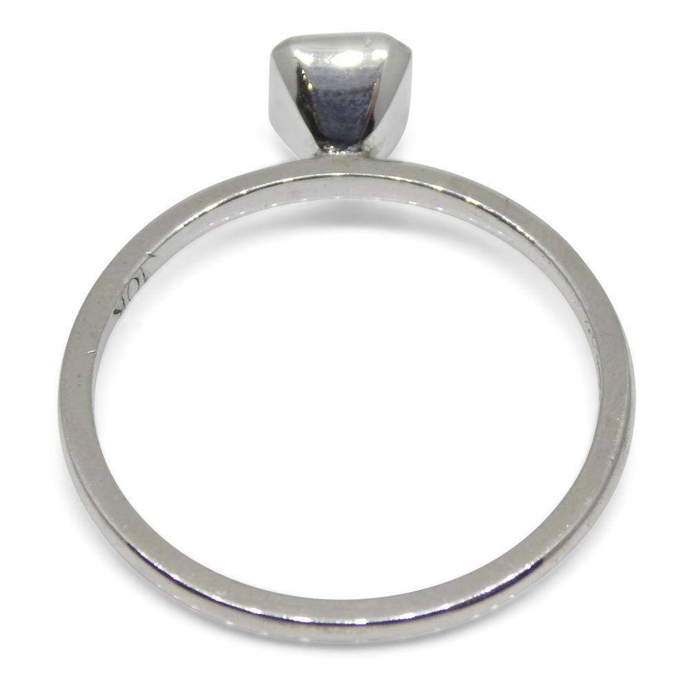 Dainty Colombian emerald octagon-cut stacker ring in 10kt white gold, handcrafted by SkyJems Canadian jewellers