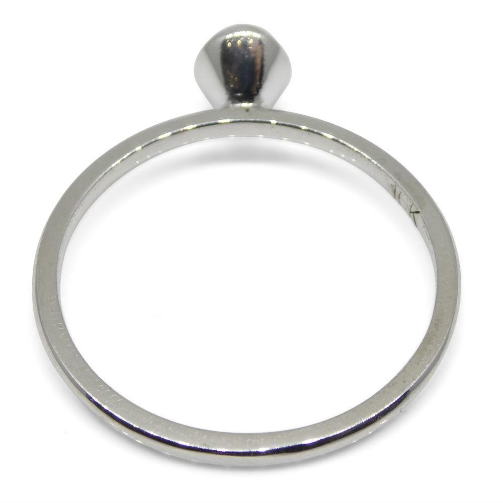 Dainty red tourmaline stacker ring in 10kt white gold, handcrafted by SkyJems Canadian jewellers, elegant oval solitaire desi