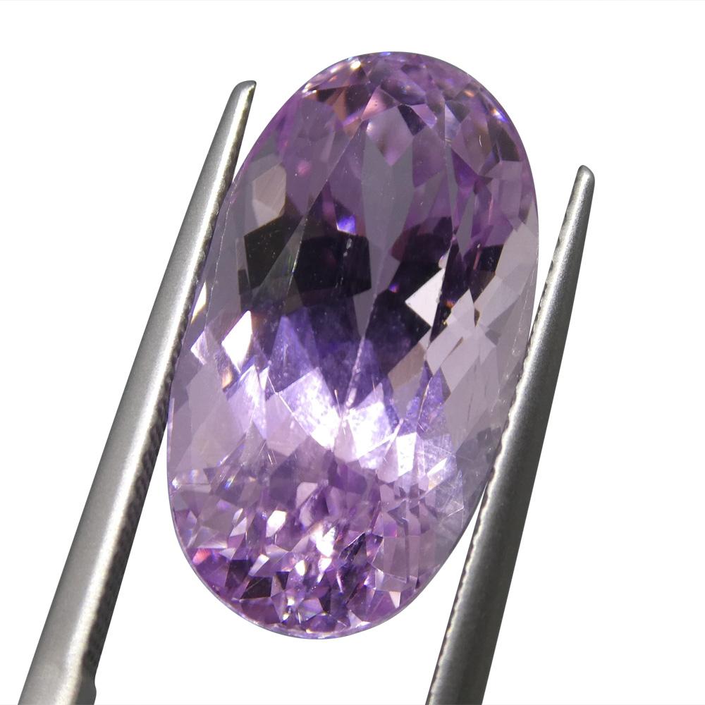 15.98 ct Slightly Purplish Pink Kunzite from Afghanistan, oval mixed cut gemstone by SkyJems Canadian gem specialists