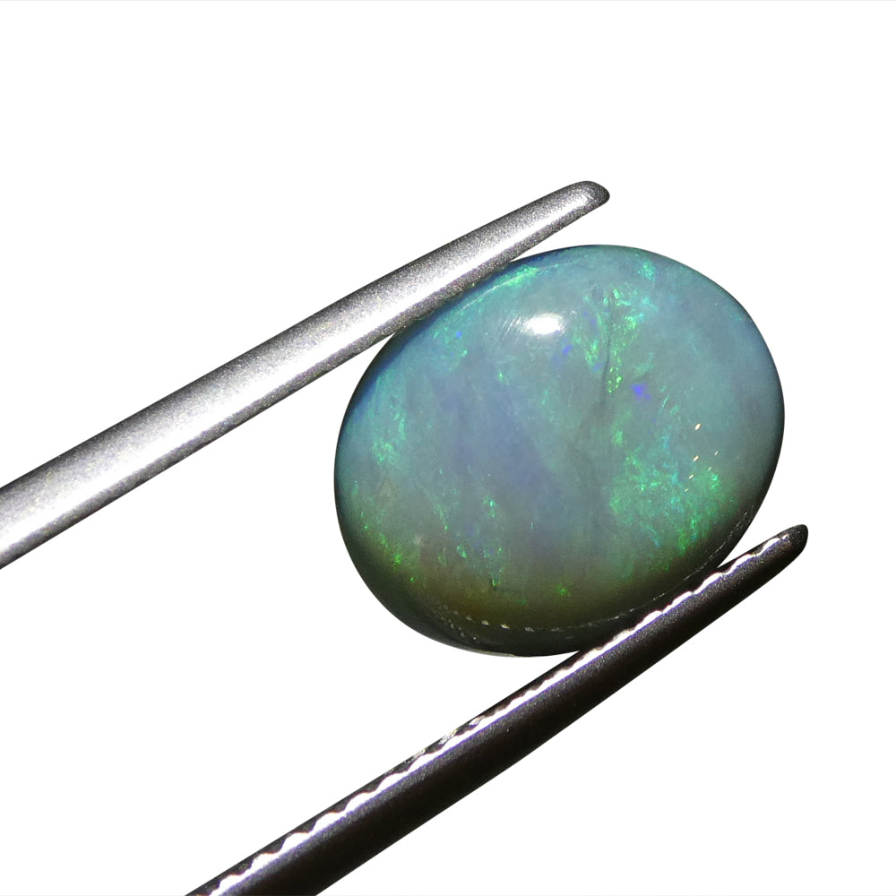 2.37ct Australian Black Opal with vivid play of color, oval cabochon cut - premium gemstone from SkyJems' curated collection