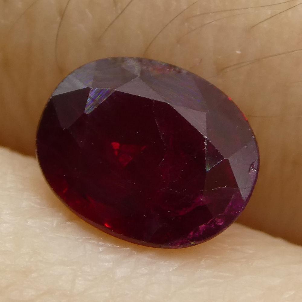 0.8 ct Oval Mozambique Ruby, vibrant red single stone from Africa, precision-cut by SkyJems Canadian gem experts