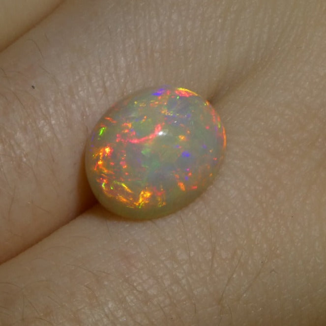 SkyJems 3.6ct White Welo Opal Cabochon from Ethiopia with vibrant play of color, oval-cut gemstone
