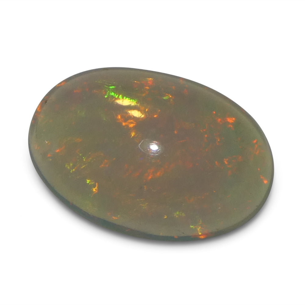 2.71ct White Crystal Opal from Ethiopia, oval cabochon gemstone with play of colour by SkyJems Canadian gem experts