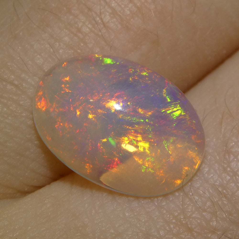 2.71ct Oval Cabochon White Crystal Opal from Ethiopia - Skyjems Wholesale Gemstones