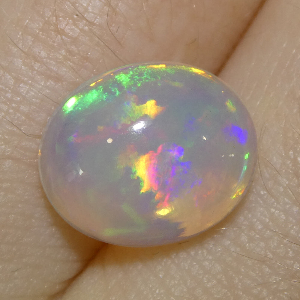 3.82ct Oval Cabochon White Crystal Opal from Ethiopia - Skyjems Wholesale Gemstones