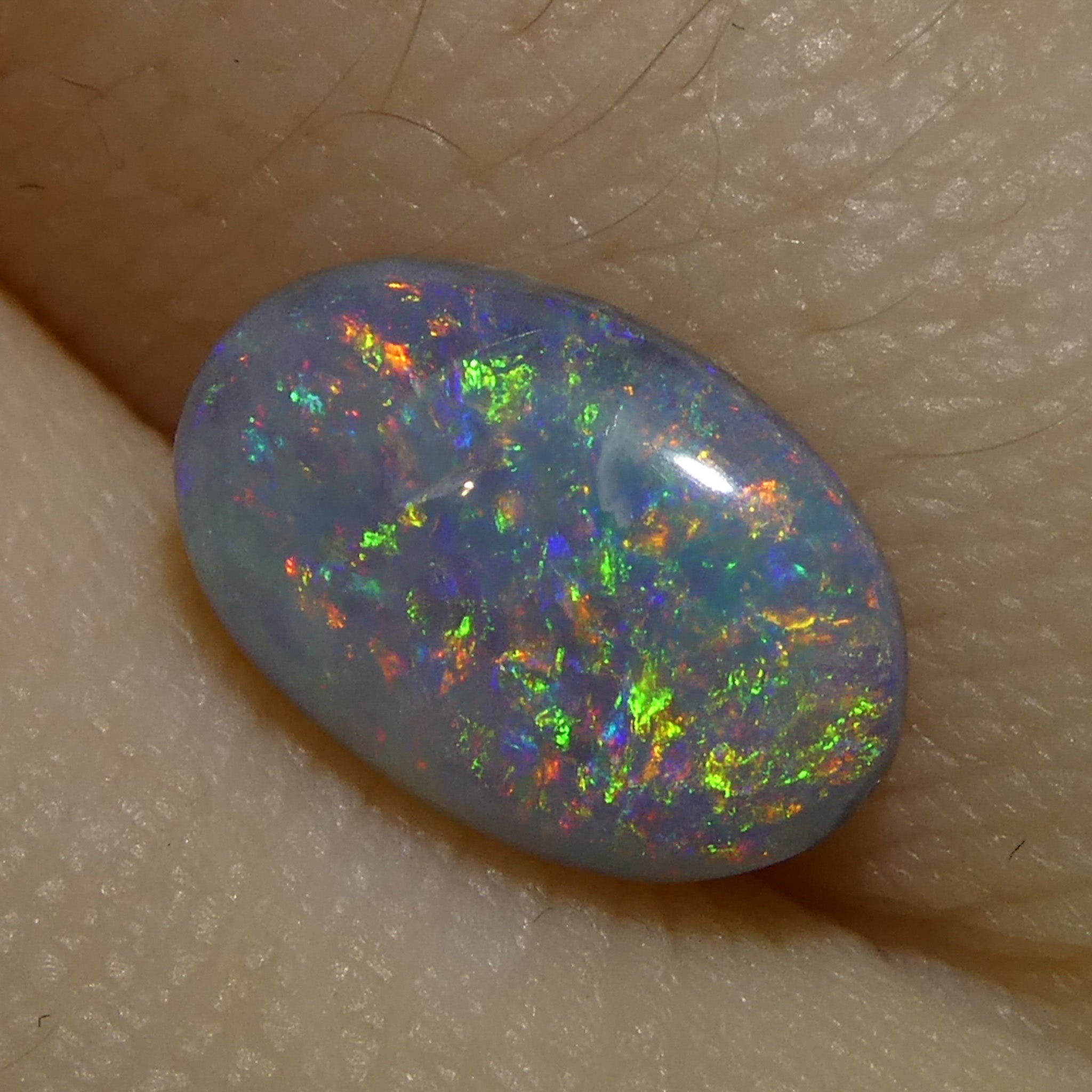 0.86ct Gray Oval Cabochon Opal from Australia, rare gemstone with play of color by SkyJems Canadian gem experts