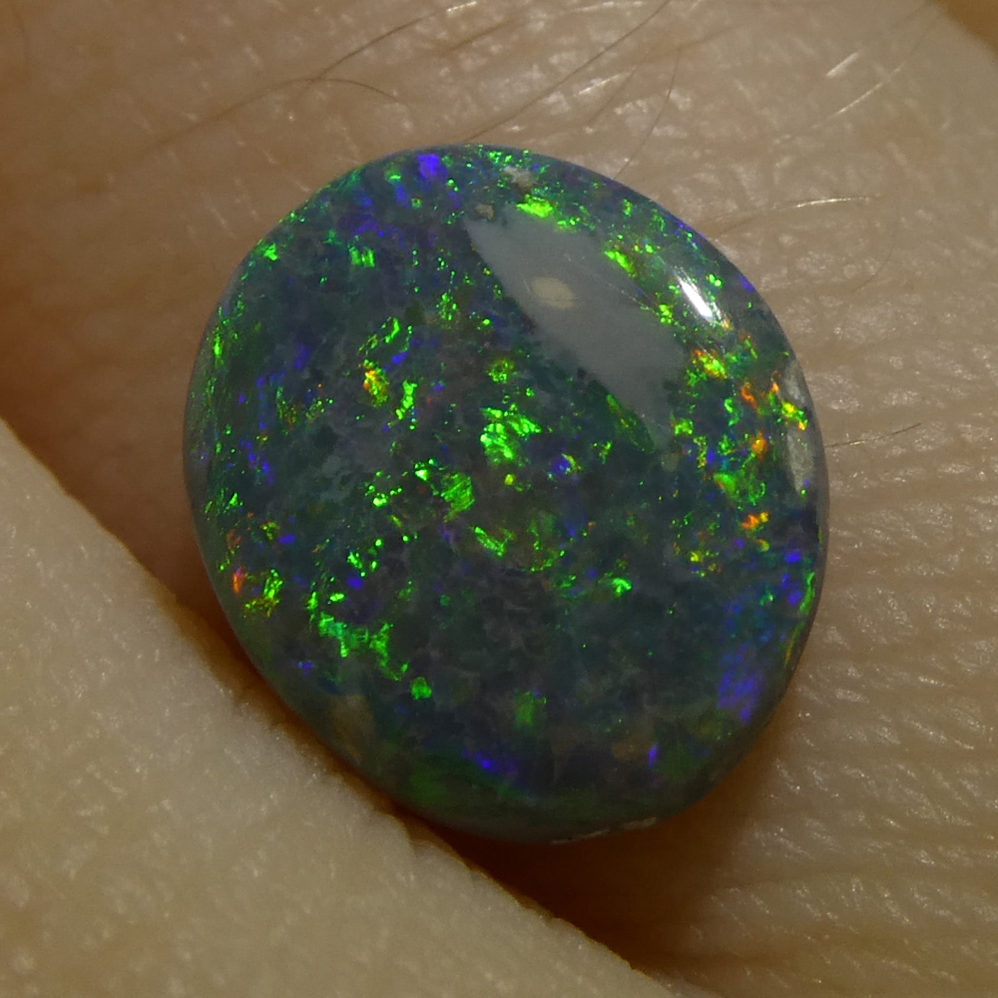 1.19ct Gray Oval Cabochon Opal from Australia, rare gemstone with play of color by SkyJems Canadian gem experts