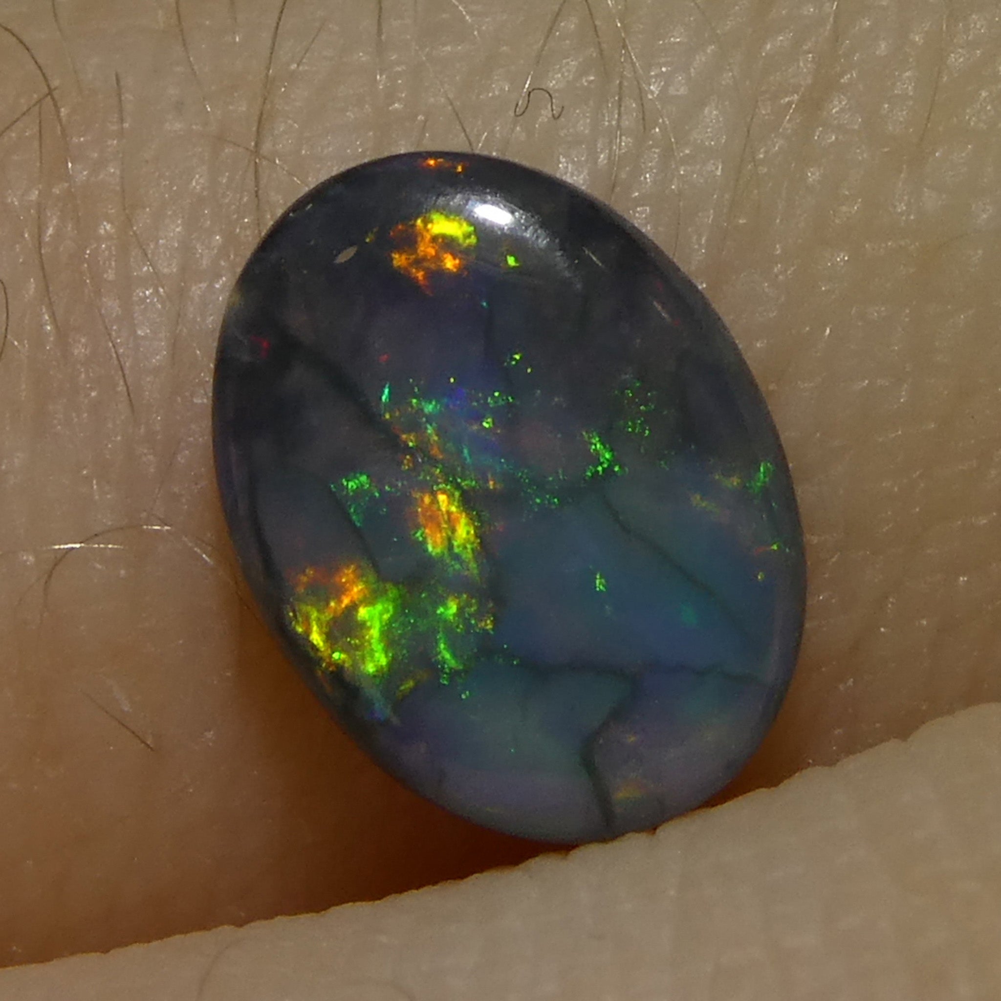 0.59ct Gray Oval Cabochon Opal from Australia, rare gemstone with play of color by SkyJems Canadian gem experts