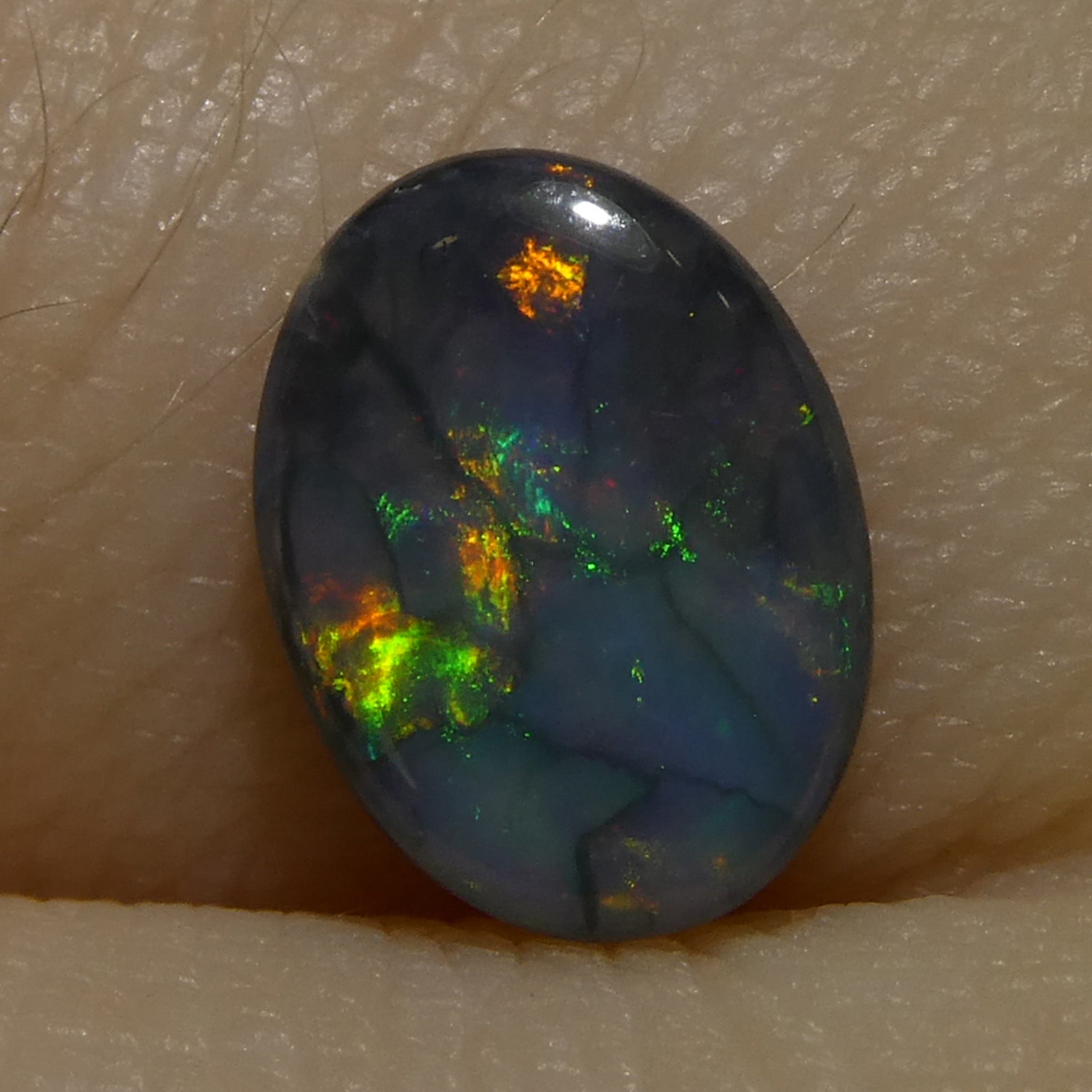 0.59ct Gray Oval Cabochon Opal from Australia, rare gemstone with play of color by SkyJems Canadian gem experts