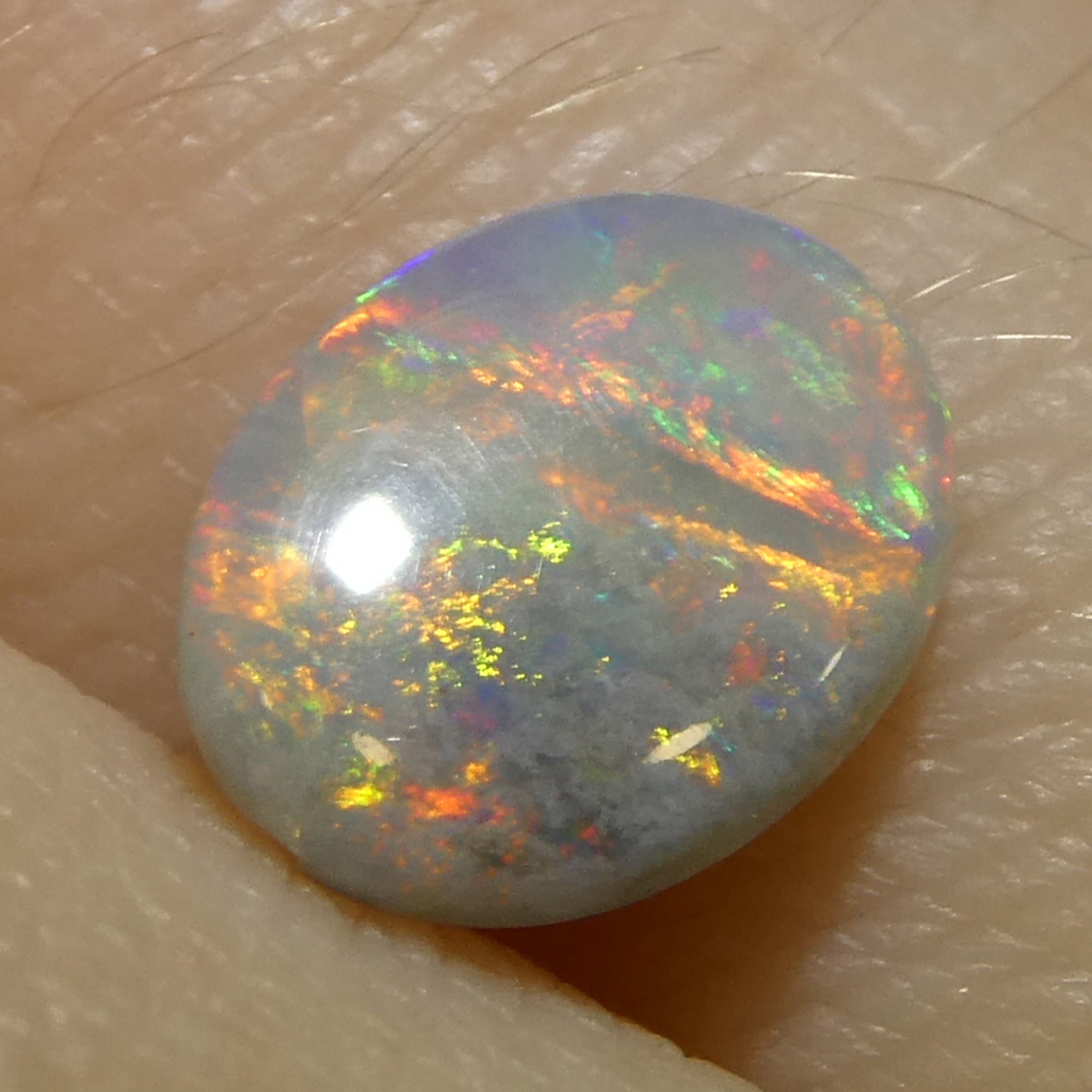 0.54ct Gray Oval Cabochon Opal from Australia, rare gemstone with play of color by SkyJems Canadian gem experts