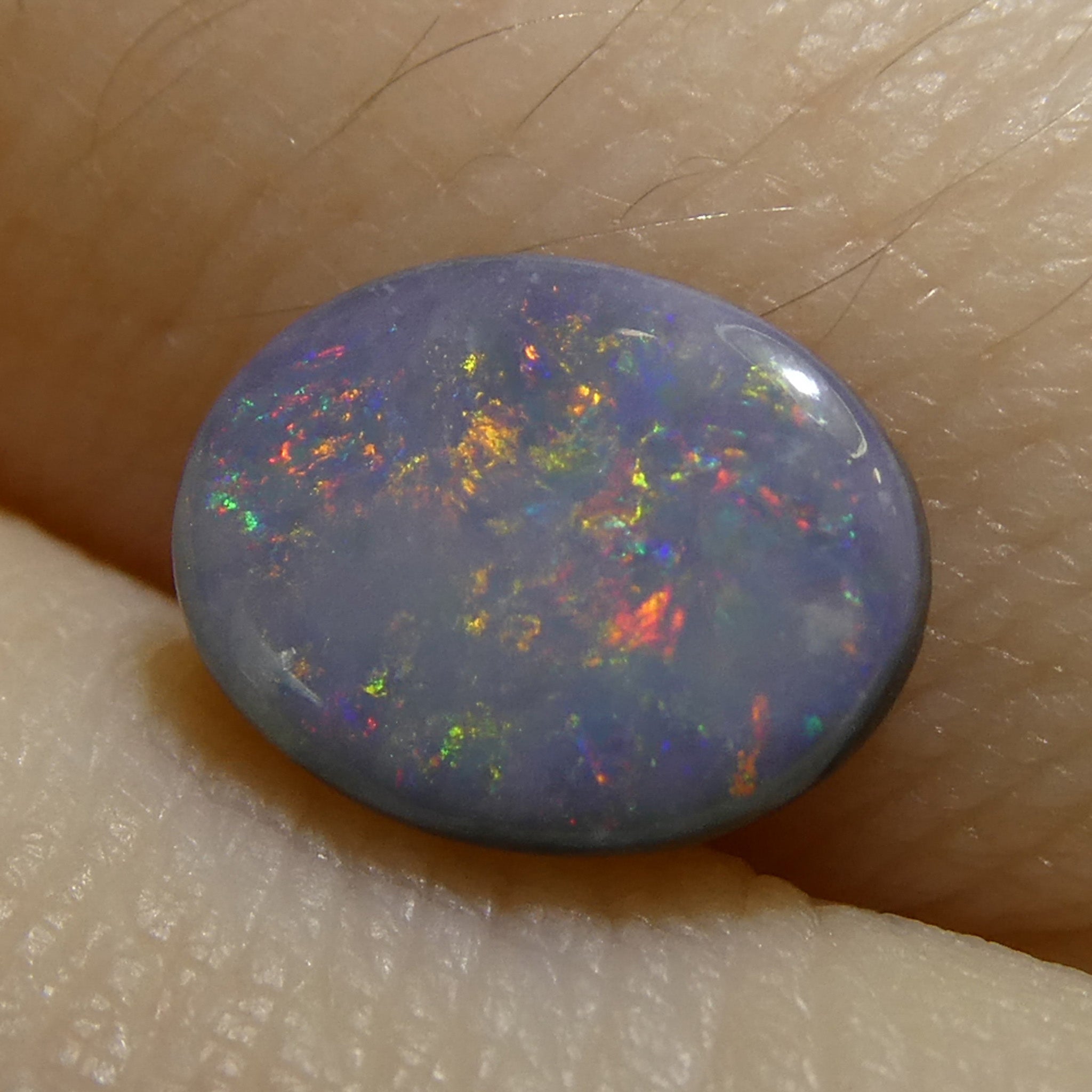 0.62ct Gray Oval Cabochon Opal from Australia, rare gemstone with play of color by SkyJems Canadian gem experts