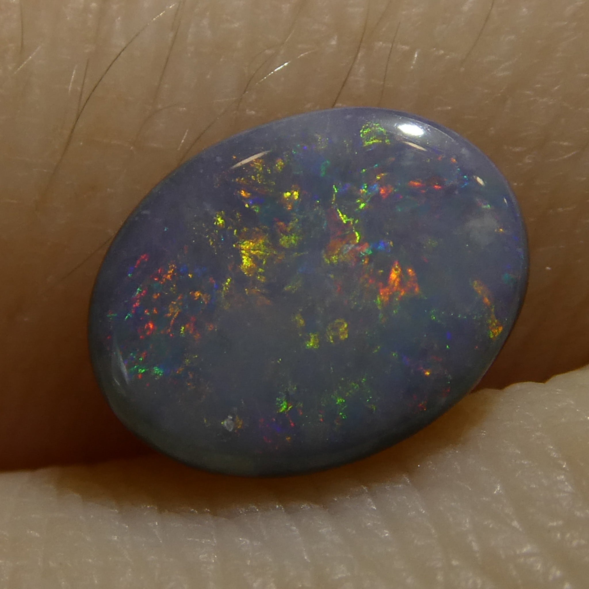 0.62ct Gray Oval Cabochon Opal from Australia, rare gemstone with play of color by SkyJems Canadian gem experts