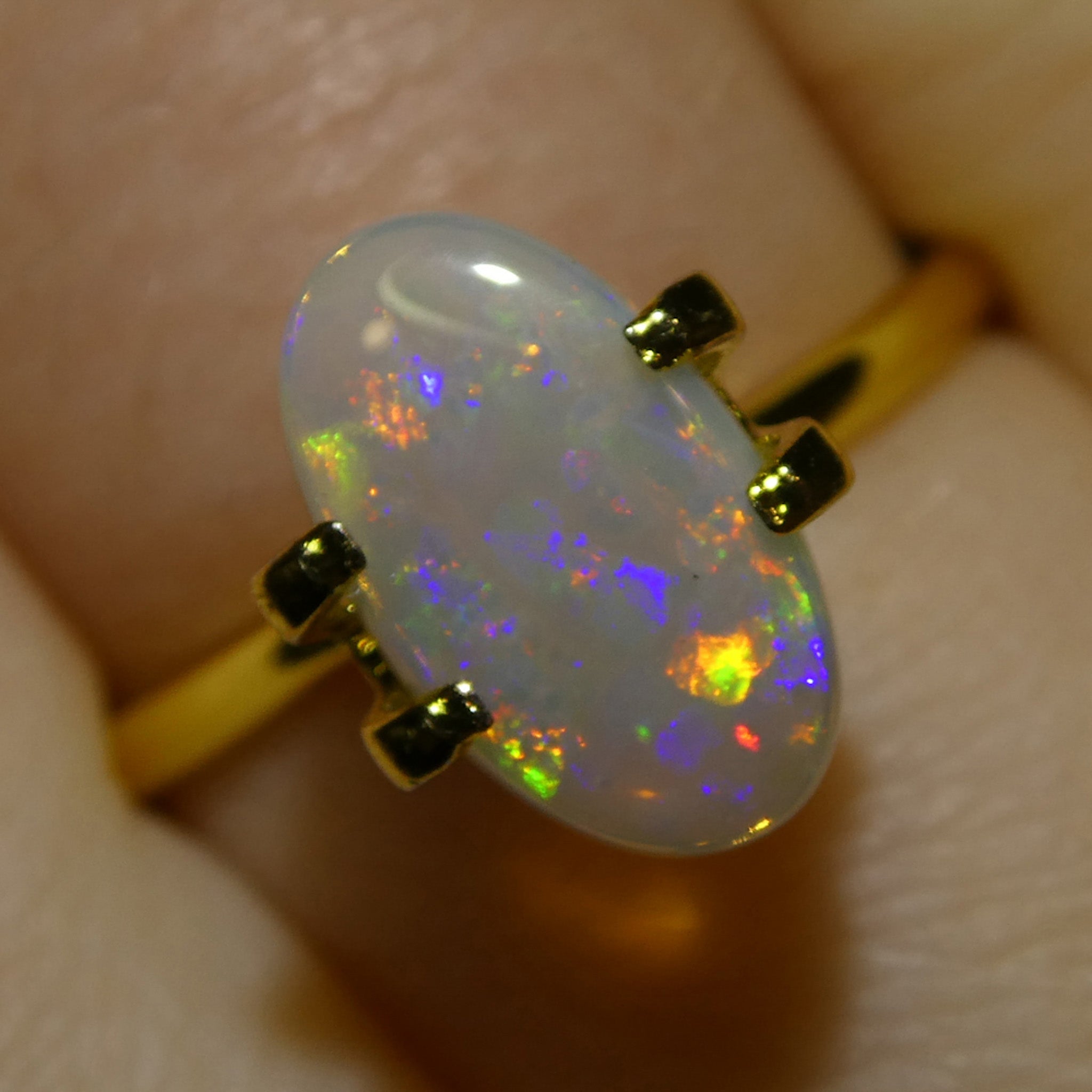 1.32ct White Oval Cabochon Opal from Australia with Play of Color | Premium Gemstone by SkyJems