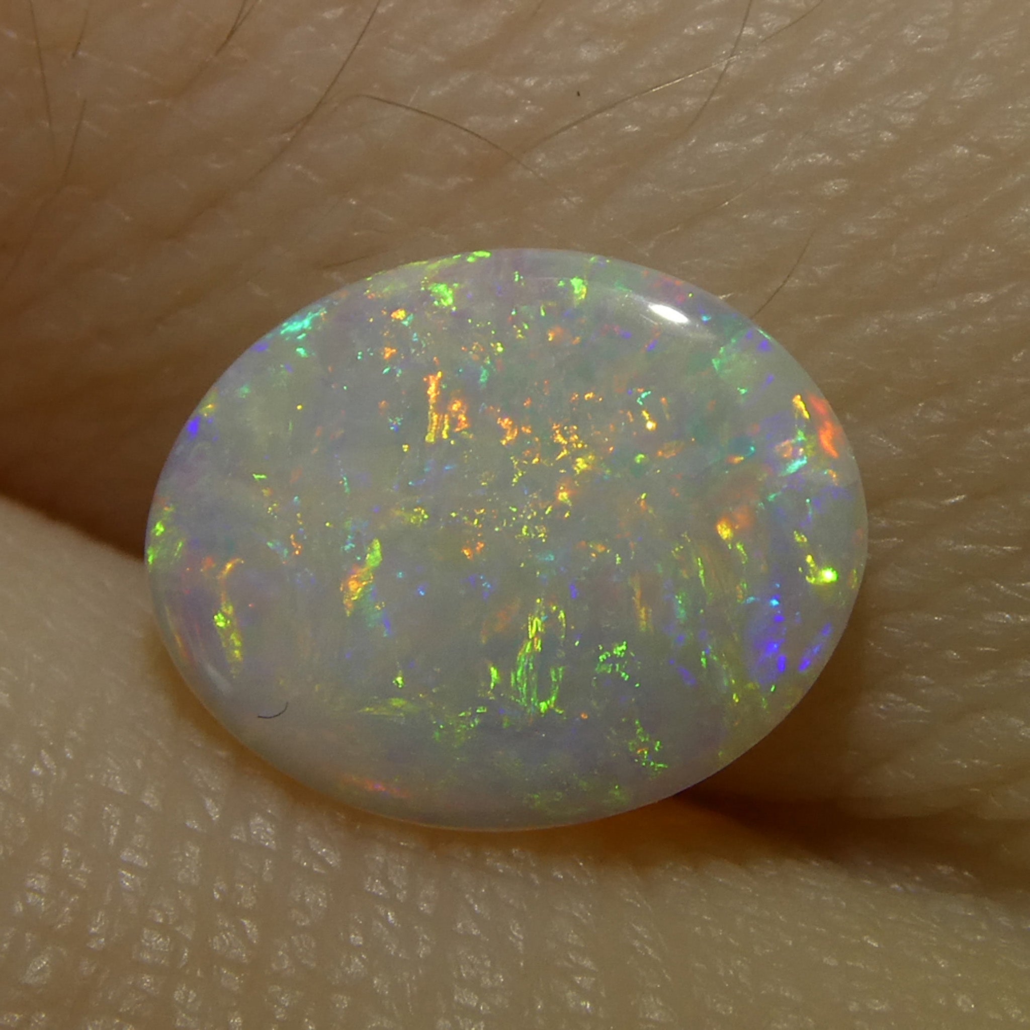 0.55ct White Oval Cabochon Opal from Australia, premium gemstone by SkyJems Canadian gem specialists