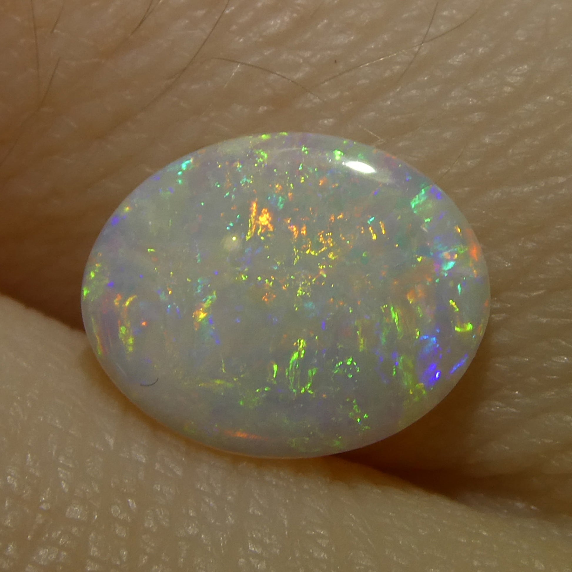 0.55ct Oval Cabochon White Opal from Australia - Skyjems Wholesale Gemstones