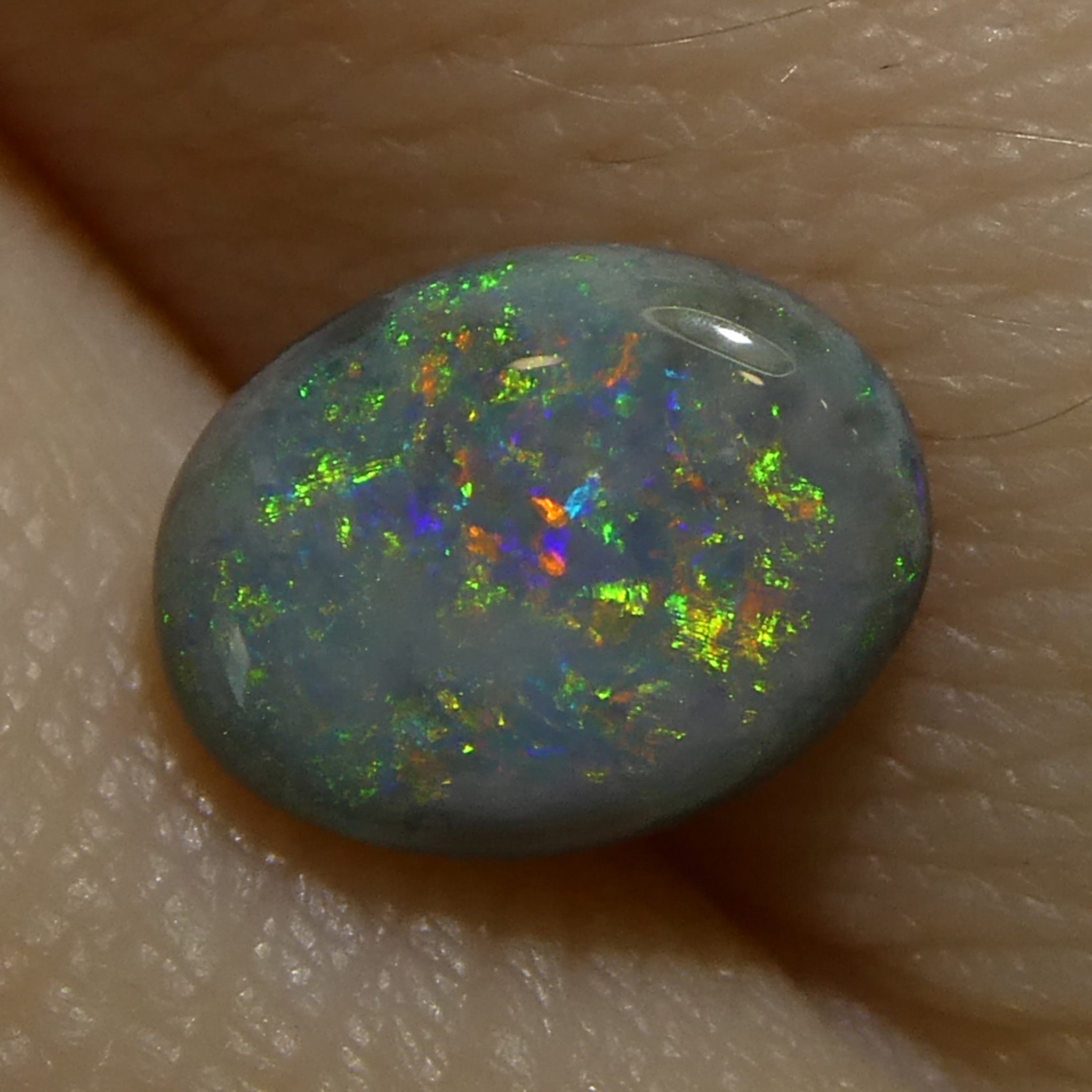 0.64ct Gray Oval Cabochon Opal from Australia with play of color, premium gemstone by SkyJems Canadian gem specialists